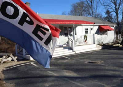 view of Wellfleet Box Lunch with "open" flag waving in the forefront